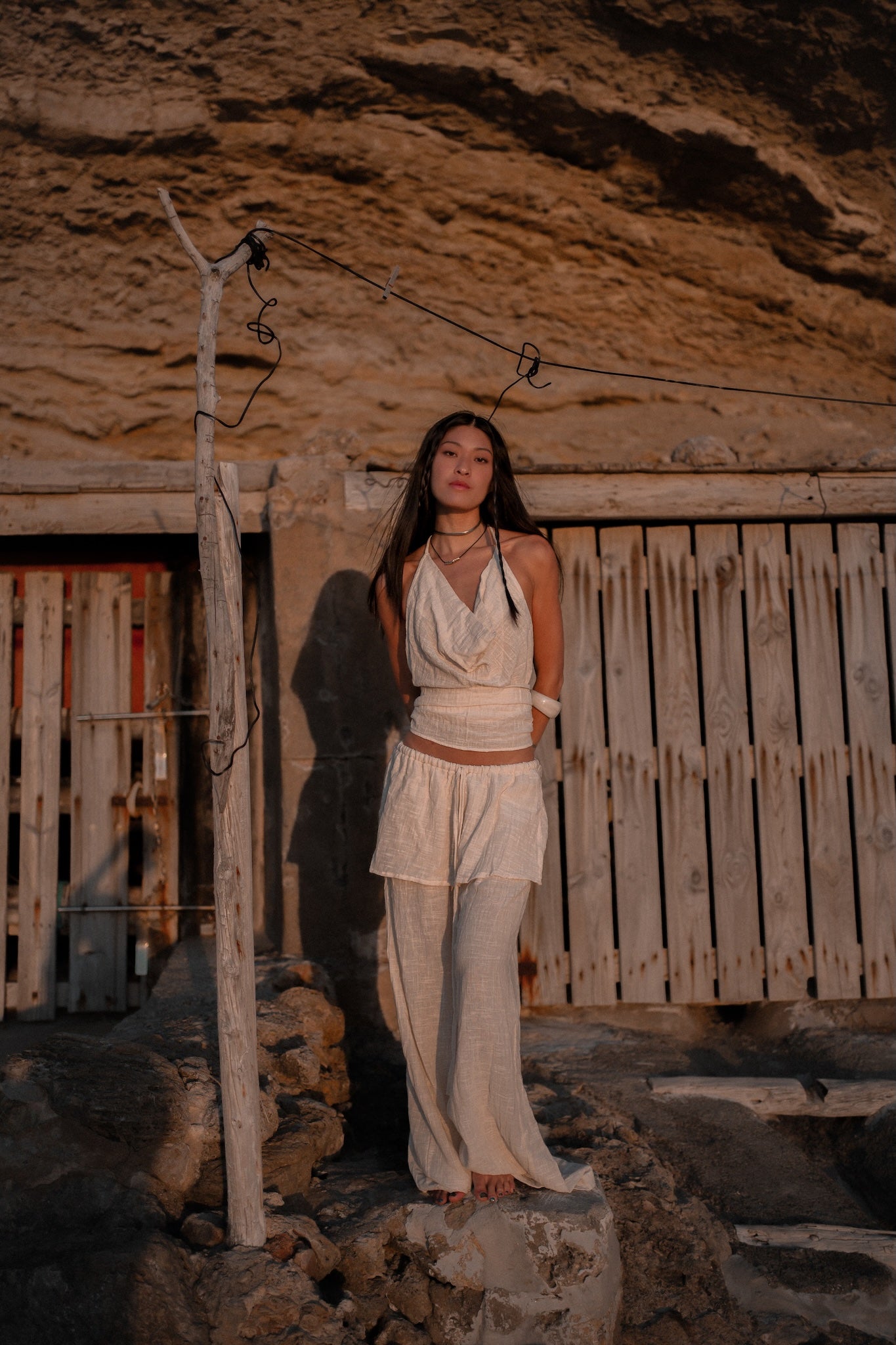 Flowing layered trousers paired with a multiway bamboo top for resort wear