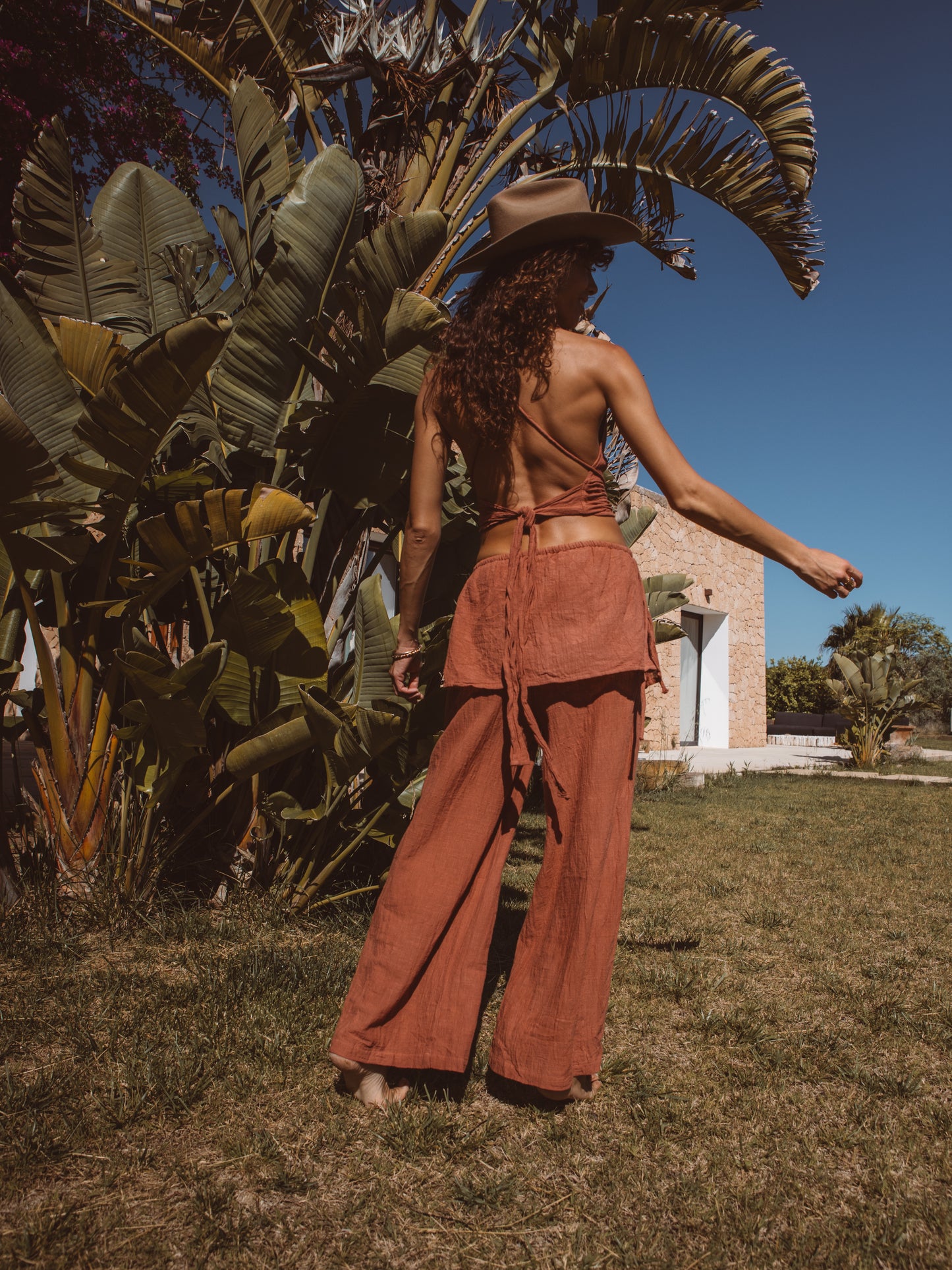 Flowing layered trousers paired with a multiway bamboo top for resort wear