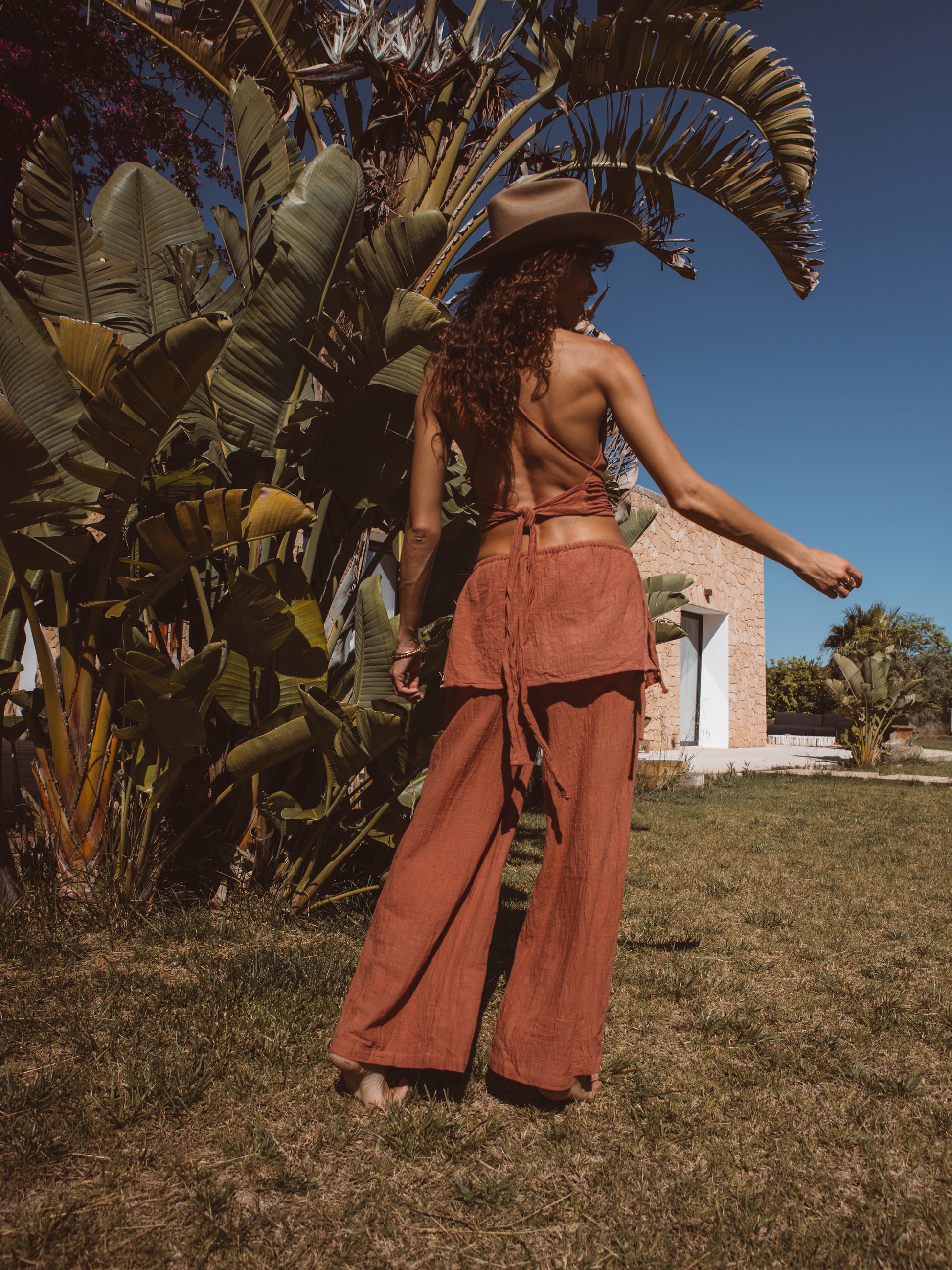 Flowing layered trousers paired with a multiway bamboo top for resort wear