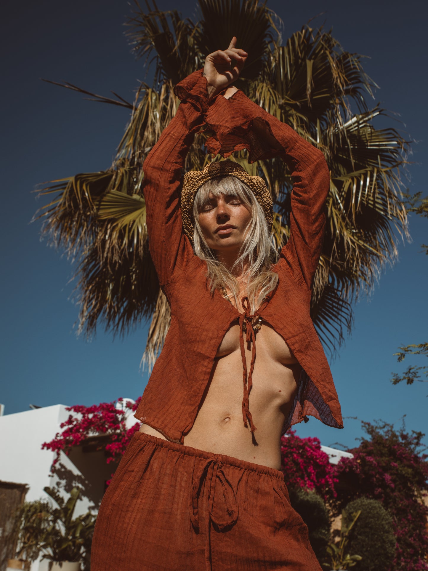 Bohemian two piece resort set in Terra Cotta and natural indigo tones